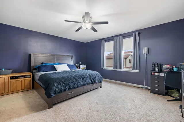 a bedroom with a bed furniture and a window