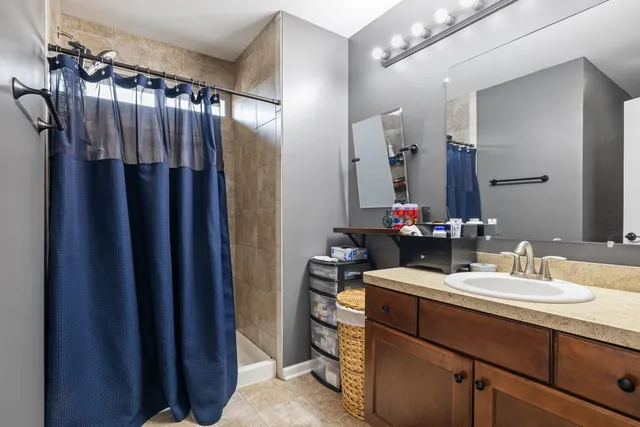 a view of walk in closet with clothes