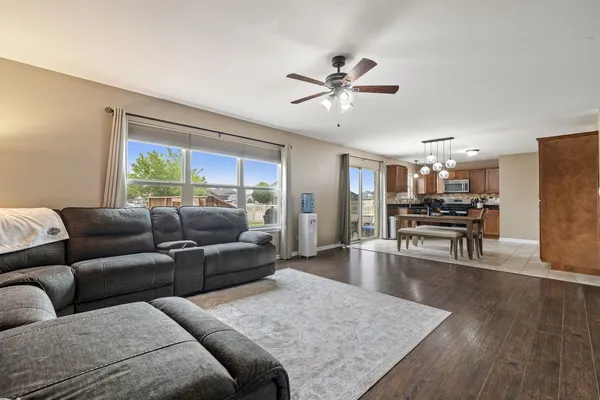 a living room with furniture and kitchen view