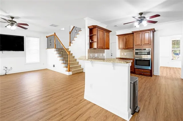 a view of living room with furniture and a window