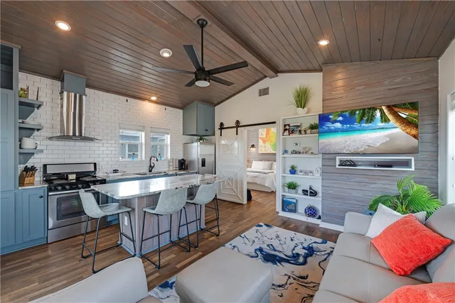 a kitchen with a table chairs stove and cabinets