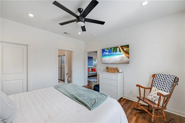 a bedroom with a bed and a dresser