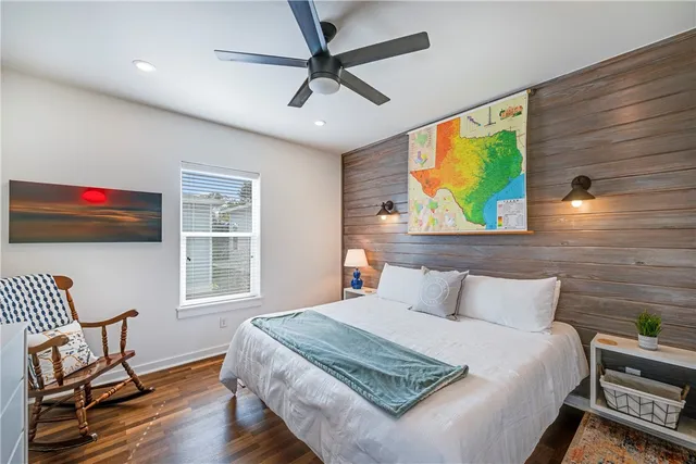 a bedroom with a bed and a chair