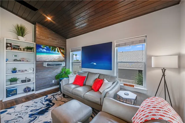 a living room with furniture and a lamp