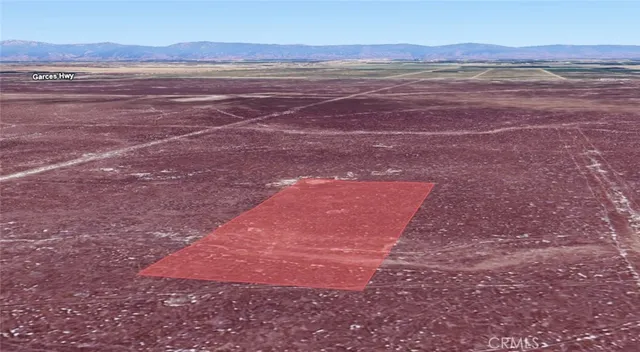 a view of an ocean with a mountain