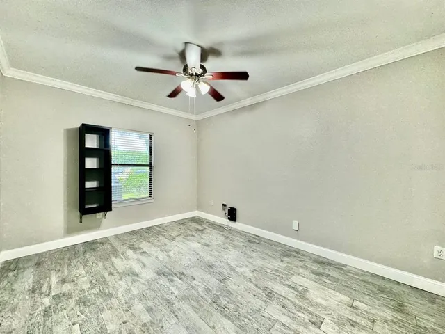 a view of an empty room with a window