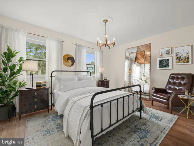 a bedroom with bed and a window