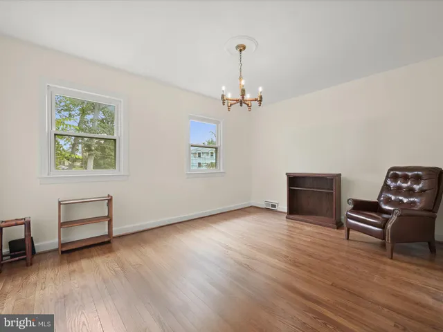a view of room with furniture wooden floor and window