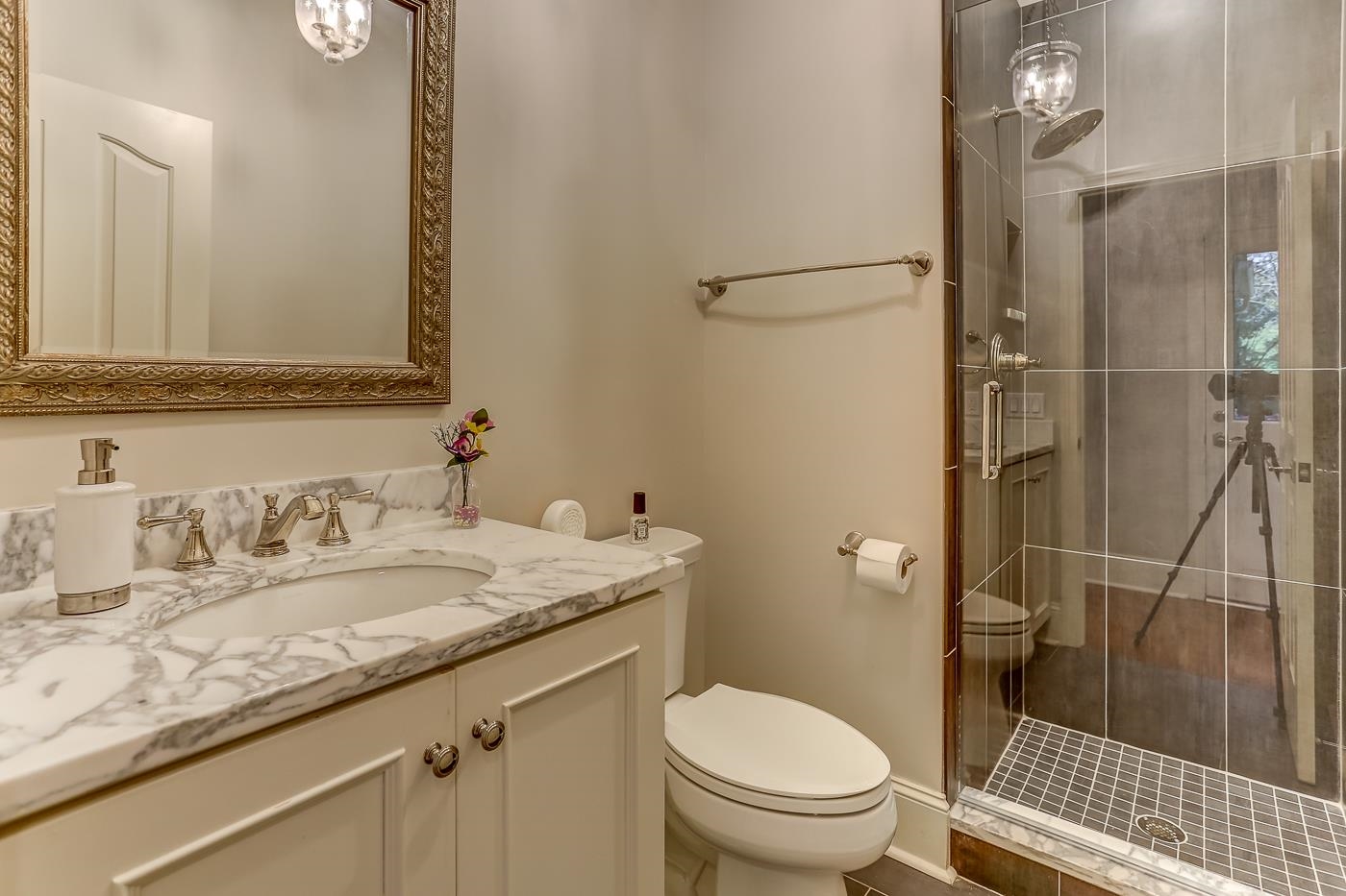 8711 Windrush Memphis, TN 38125 - Photo 15 of 40 a bathroom with a granite countertop sink toilet and shower