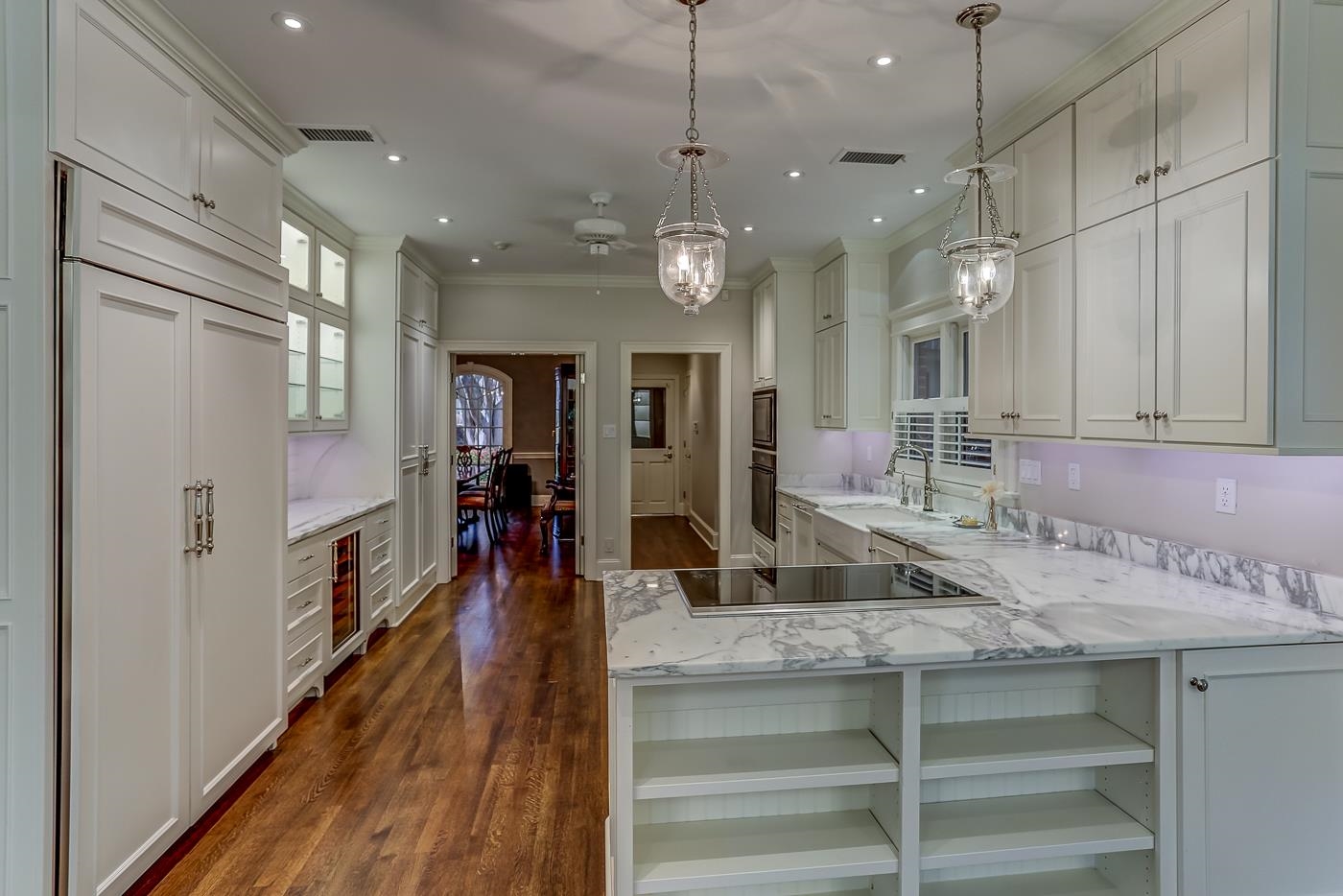 8711 Windrush Memphis, TN 38125 - Photo 17 of 40 a view of a kitchen center island cabinets and wooden floor