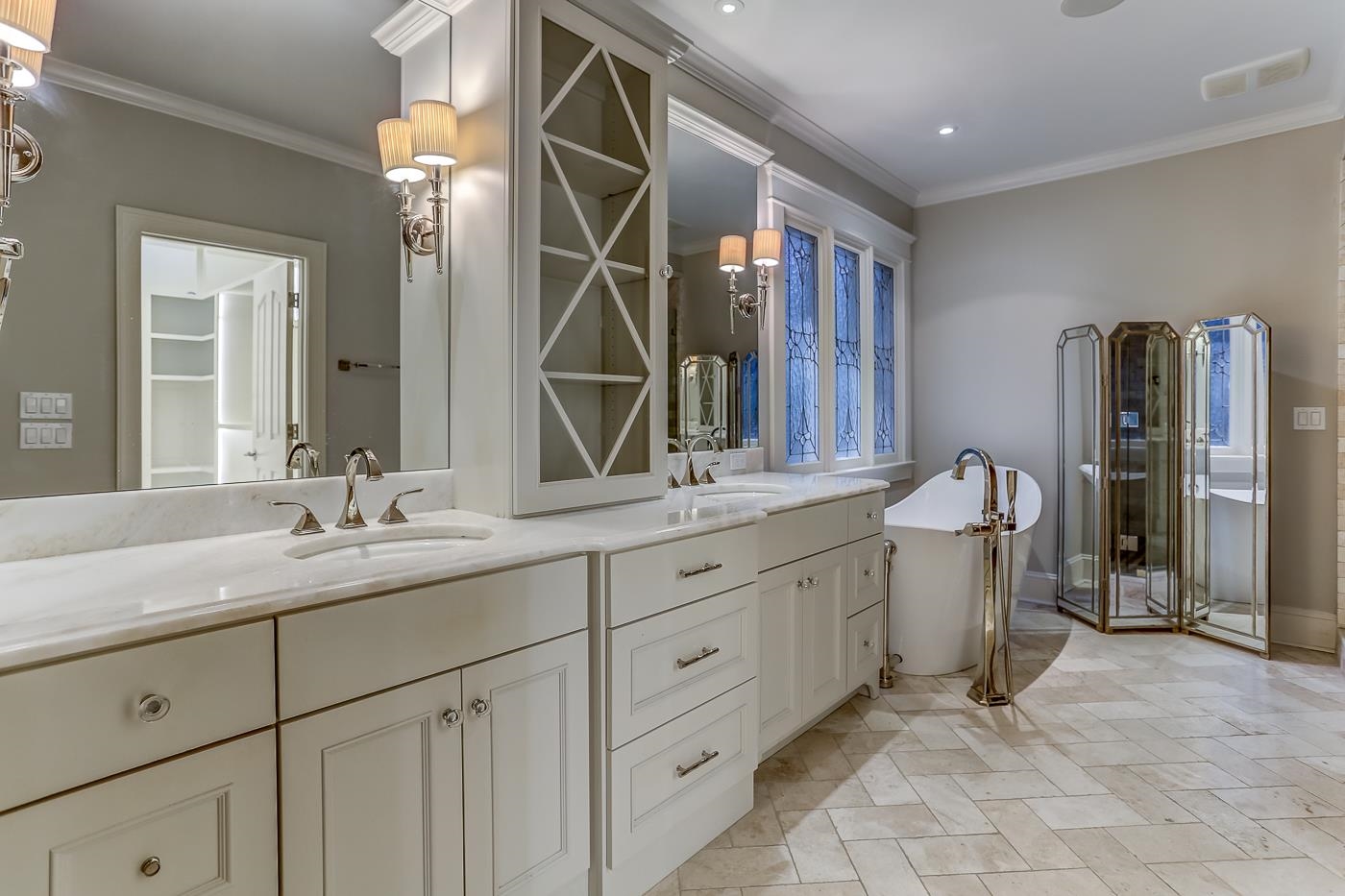 8711 Windrush Memphis, TN 38125 - Photo 30 of 40 a bathroom with double sink and a mirror