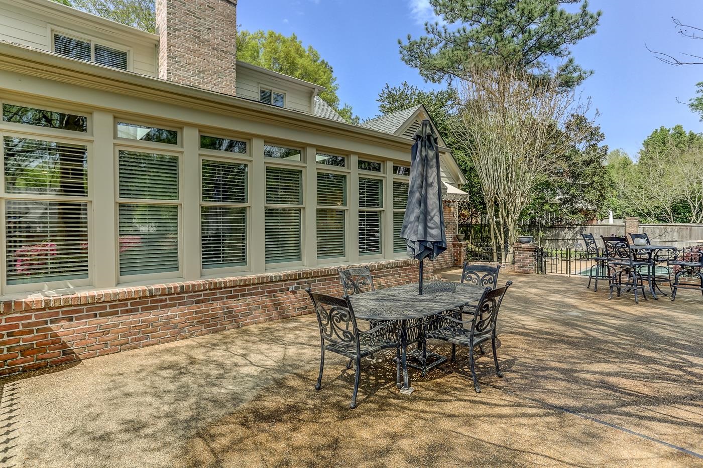 8711 Windrush Memphis, TN 38125 - Photo 7 of 40 a view of a house with backyard and sitting area