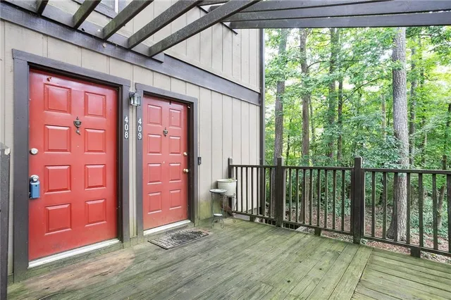 a view of a porch with wooden floor and outer view