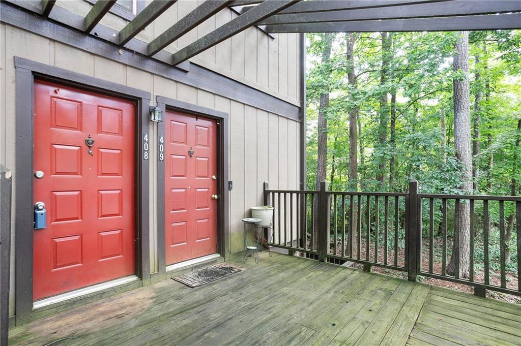 a view of a porch with wooden floor and outer view