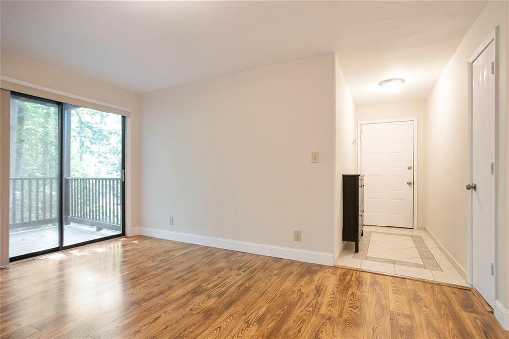 408 River Run Drive Sandy Springs, GA 30350 - Photo 20 of 34 an empty room with wooden floor and sliding door