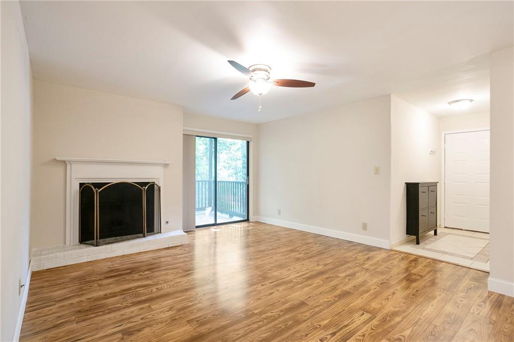 408 River Run Drive Sandy Springs, GA 30350 - Photo 4 of 34 a view of a livingroom with a fireplace and ceiling fan