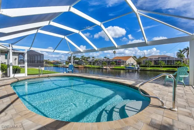 a view of a swimming pool with a patio