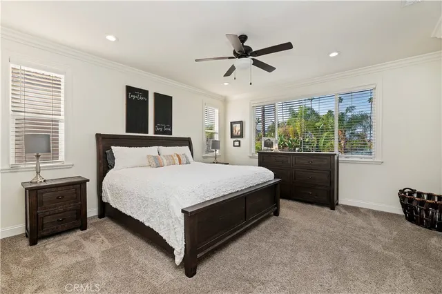 a bedroom with a bed and a mirror