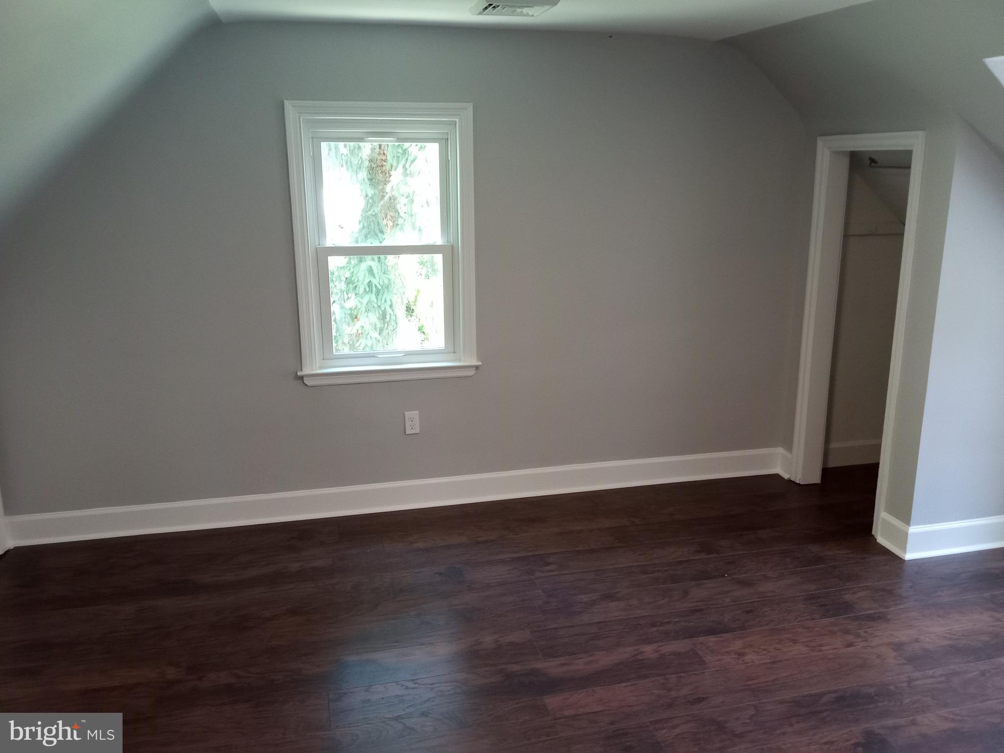 18 West Ridge Road Media, PA 19063 - Photo 6 of 7 an empty room with wooden floor and windows