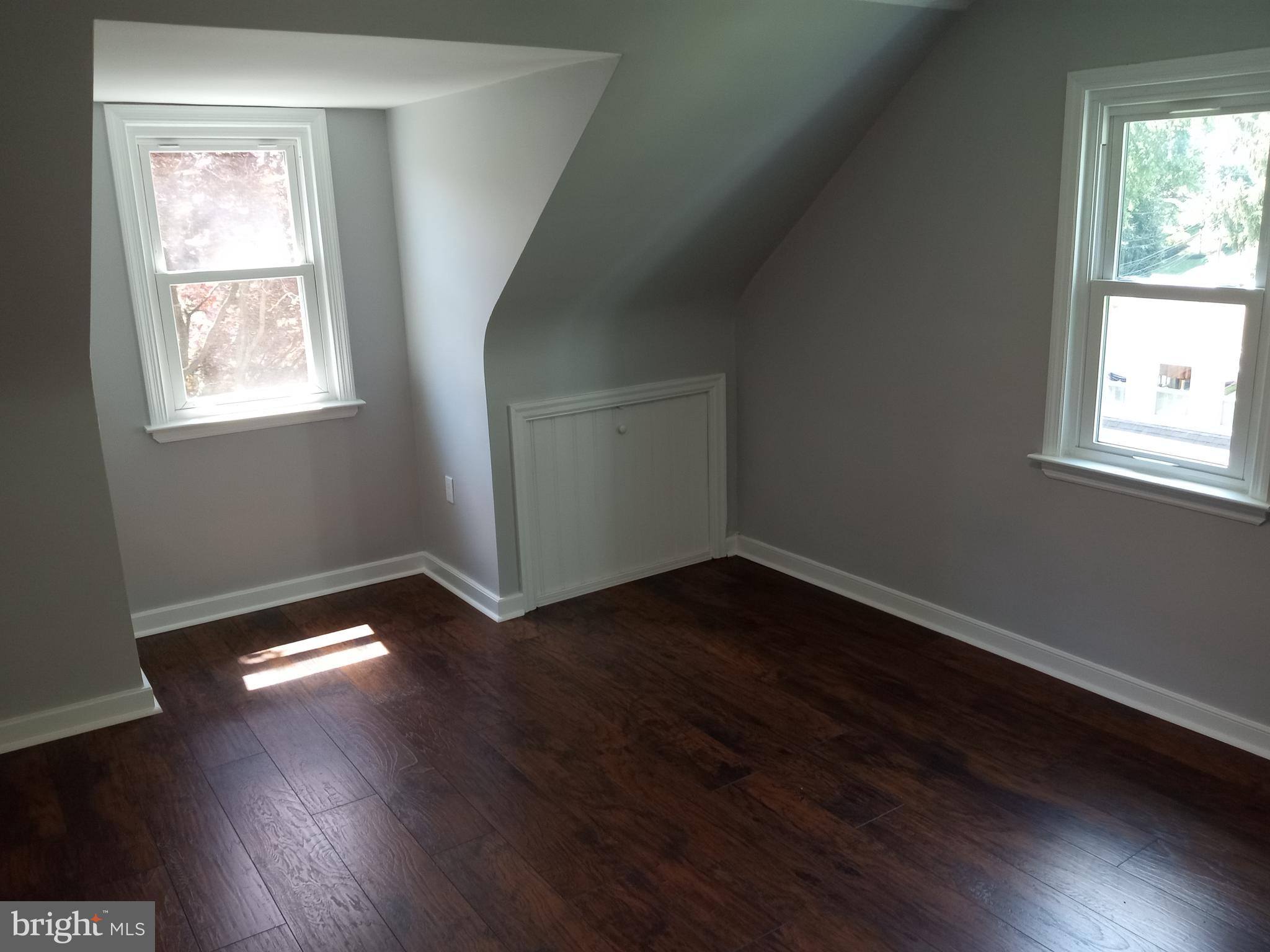 18 West Ridge Road Media, PA 19063 - Photo 7 of 7 an empty room with wooden floor and windows