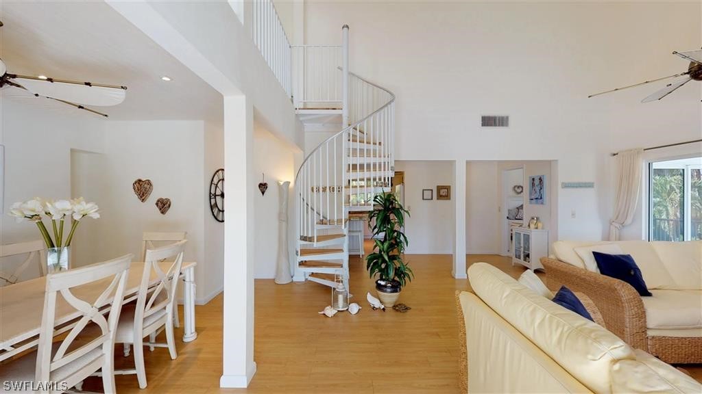 5186 Sea Bell Road Sanibel, FL 33957 - Photo 3 of 33 a living room with furniture and wooden floor