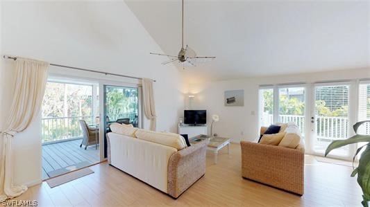 5186 Sea Bell Road Sanibel, FL 33957 - Photo 5 of 33 a living room with furniture and a flat screen tv