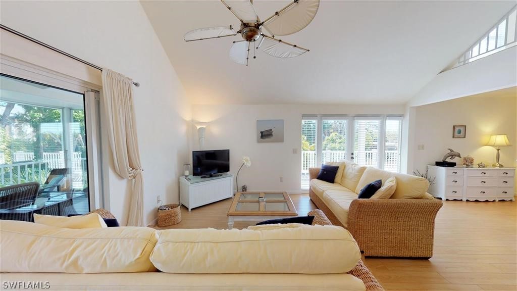 5186 Sea Bell Road Sanibel, FL 33957 - Photo 6 of 33 a living room with furniture and a flat screen tv