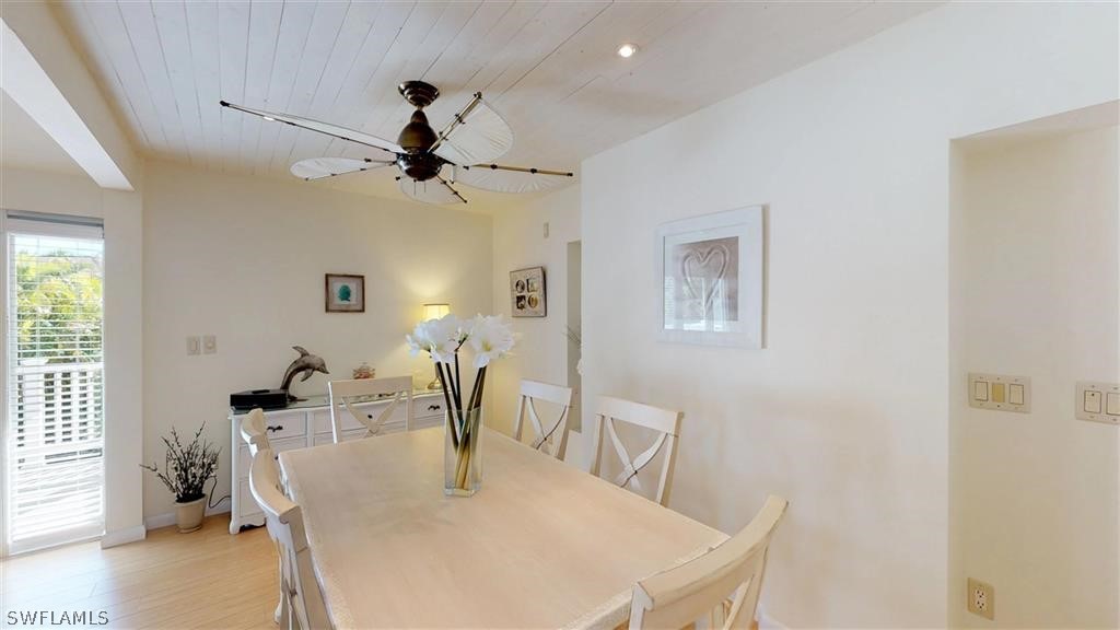 5186 Sea Bell Road Sanibel, FL 33957 - Photo 9 of 33 a dining room with furniture and window