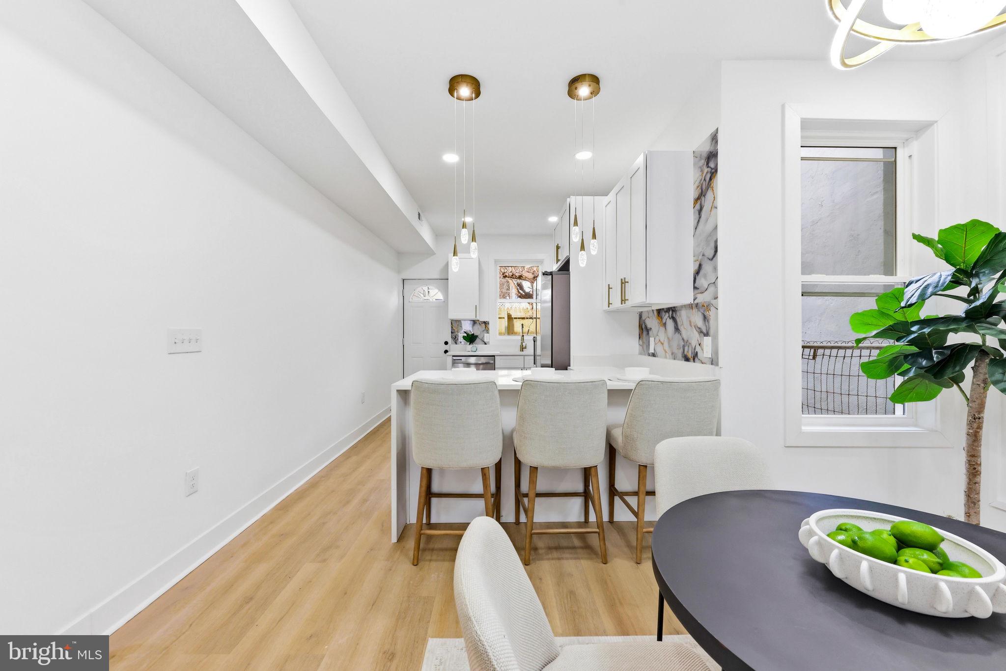 3618 Keswick Road Baltimore, MD 21211 - Photo 11 of 39 a view of a dining room with furniture and wooden floor