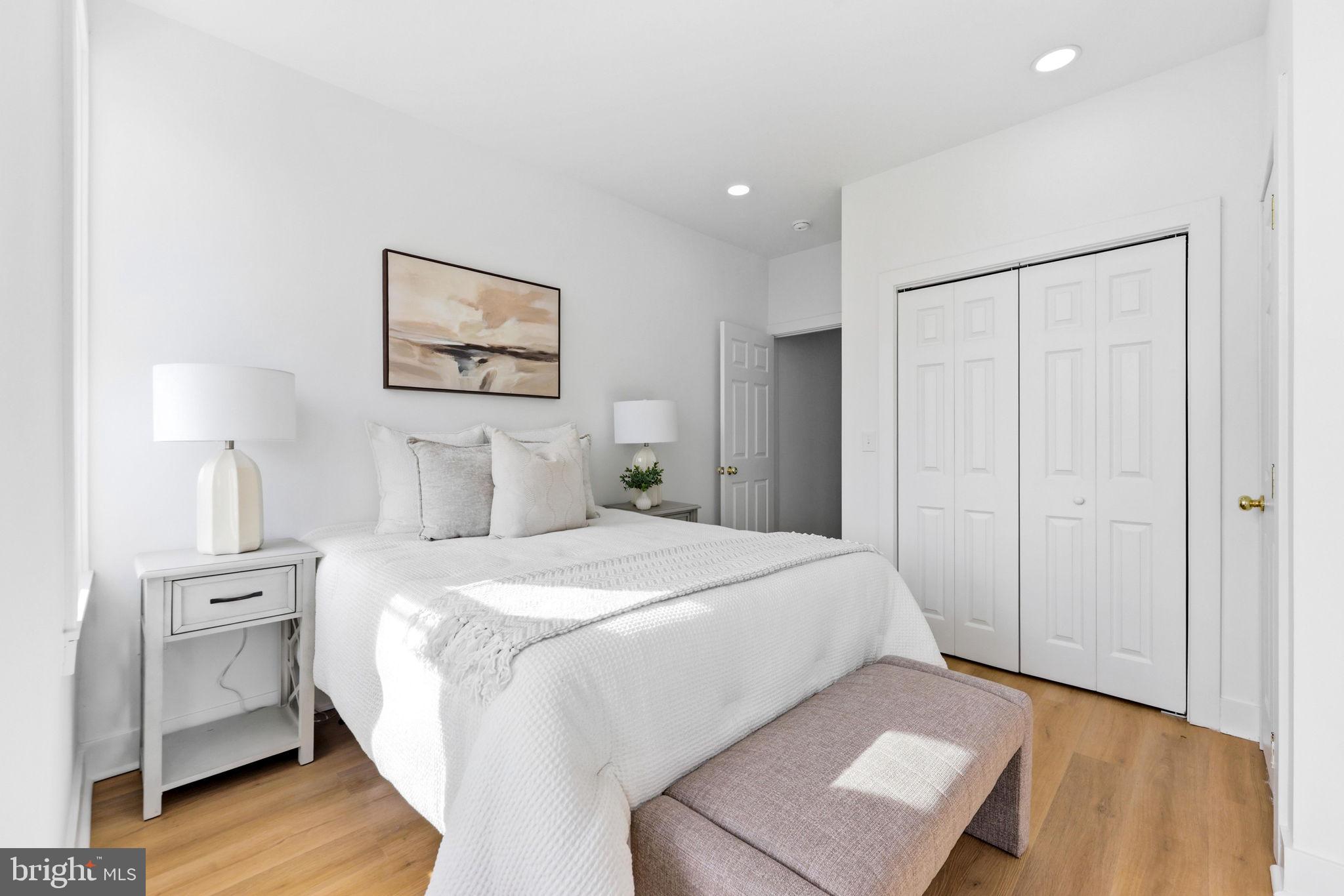 3618 Keswick Road Baltimore, MD 21211 - Photo 21 of 39 a bedroom with a bed and a night stand