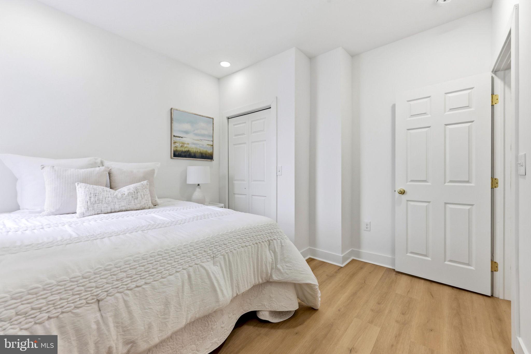 3618 Keswick Road Baltimore, MD 21211 - Photo 28 of 39 a bedroom with a bed and wooden floor