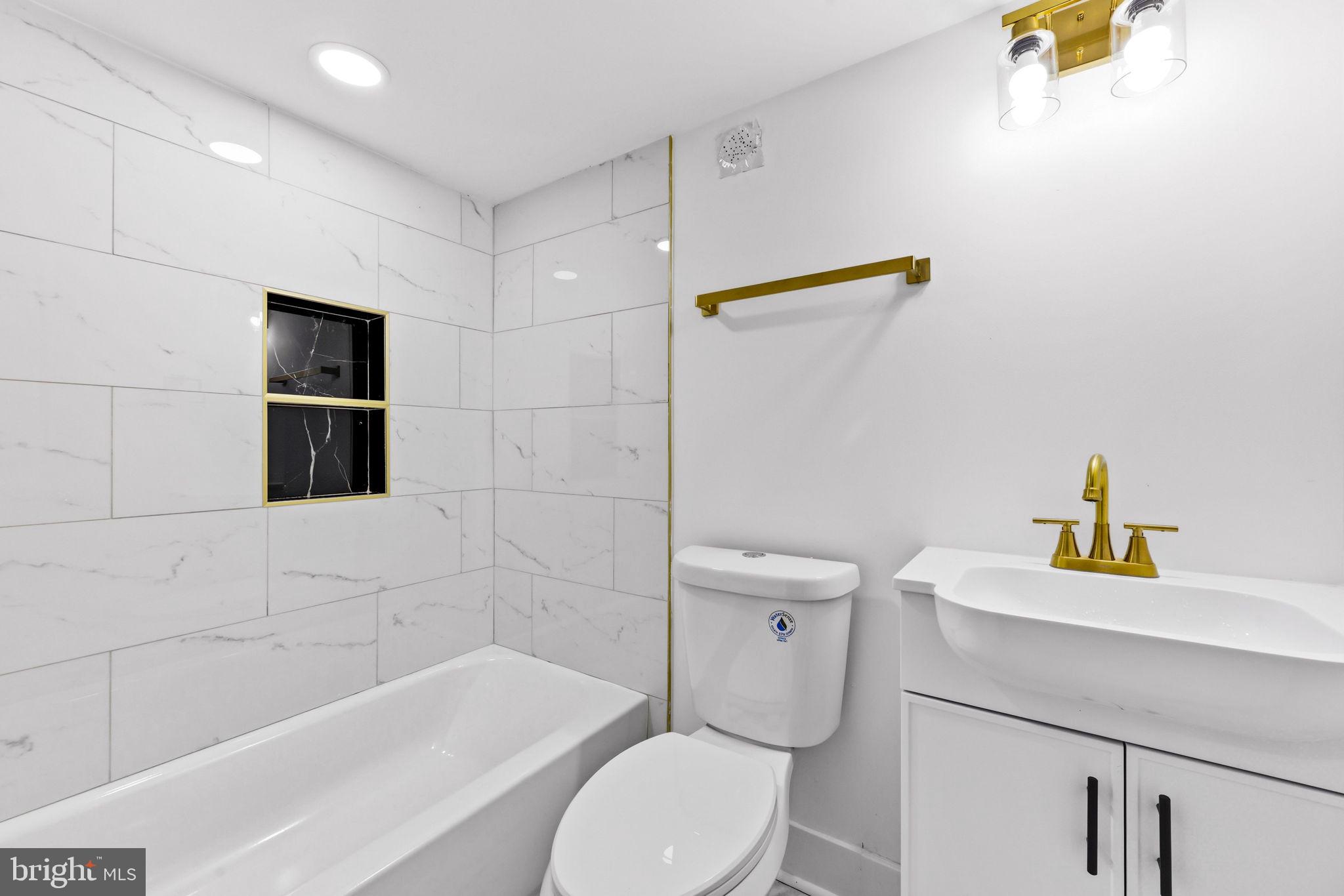 3618 Keswick Road Baltimore, MD 21211 - Photo 35 of 39 a bathroom with a sink and a bathtub