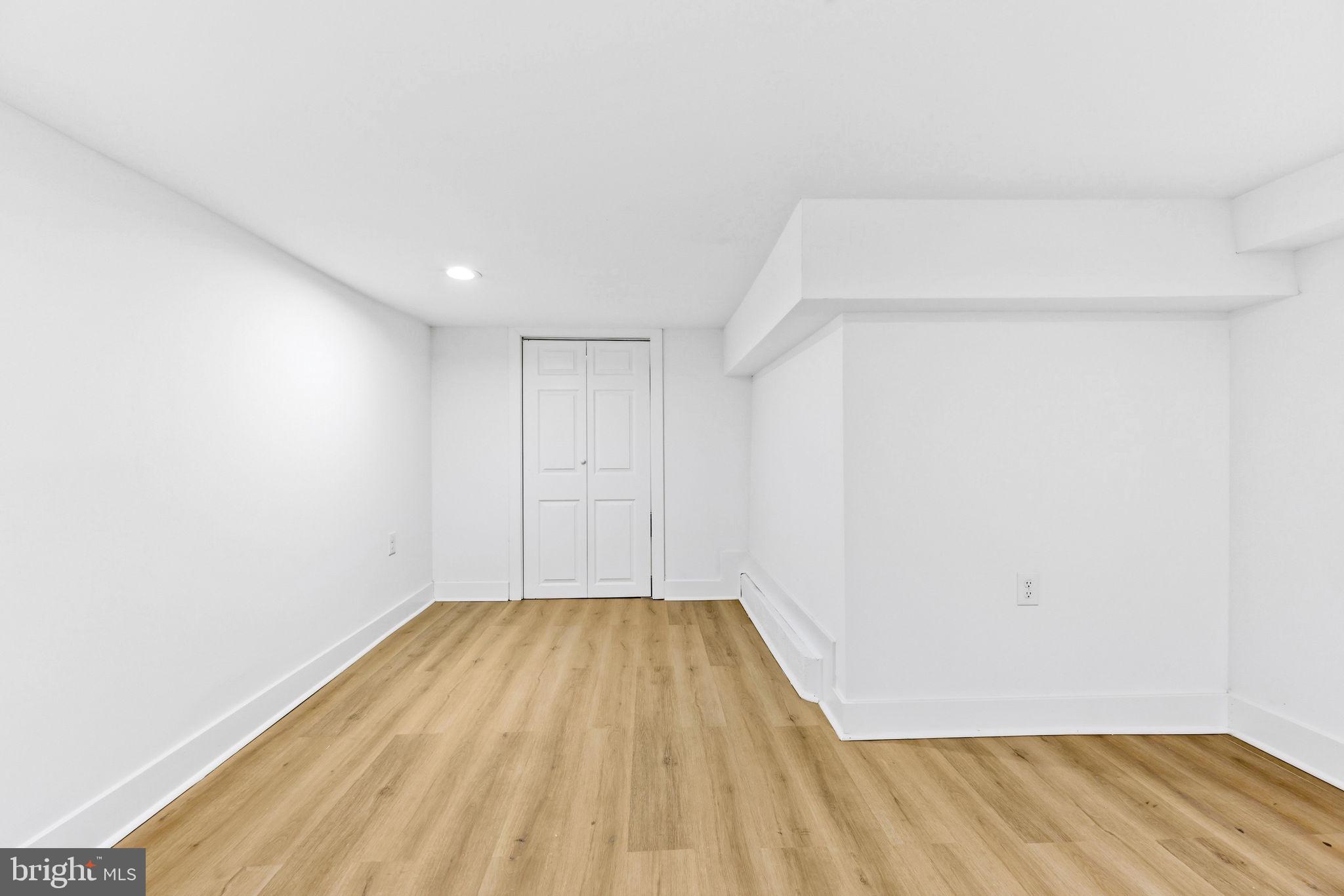 3618 Keswick Road Baltimore, MD 21211 - Photo 36 of 39 a view of a room with wooden floor and fence