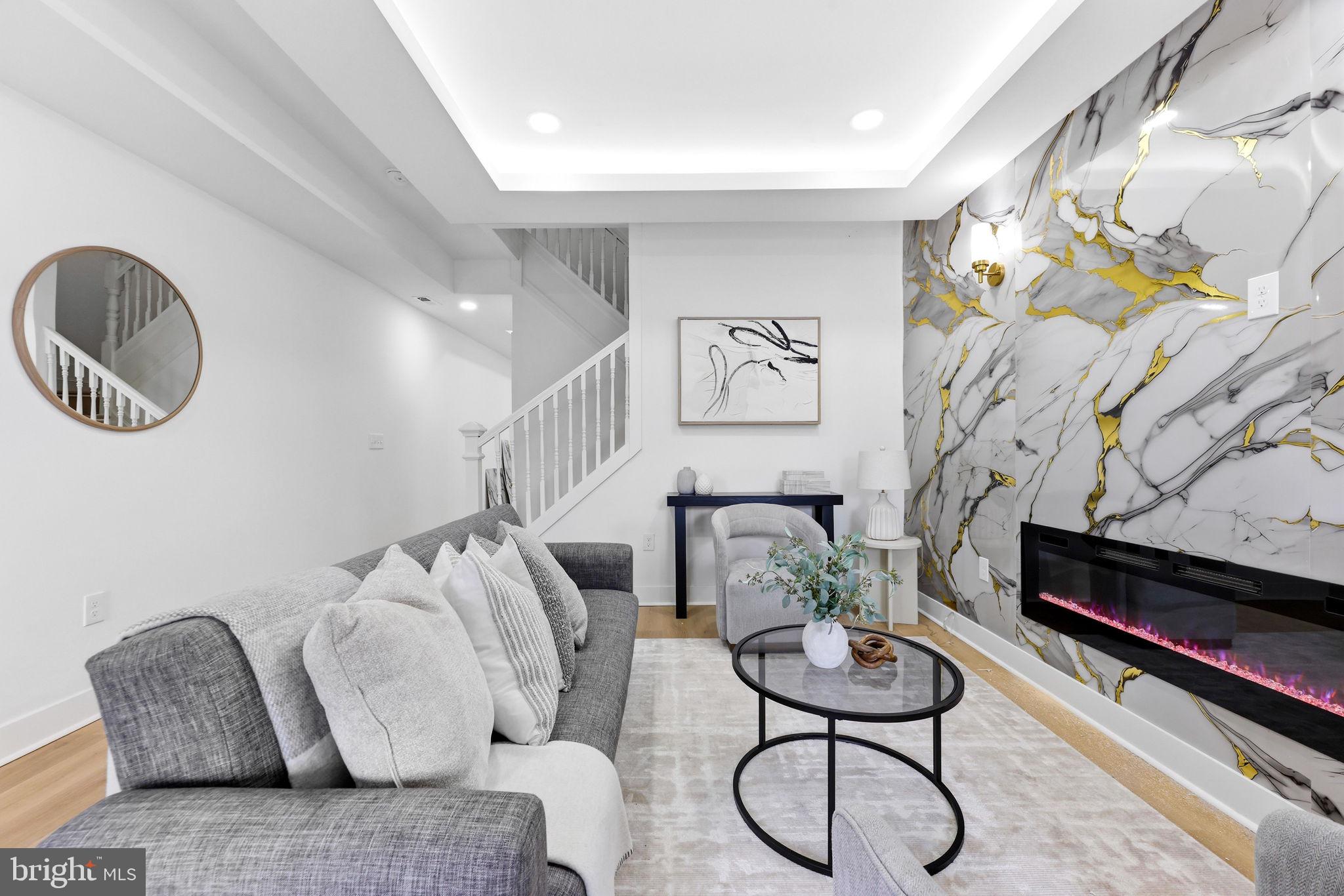 3618 Keswick Road Baltimore, MD 21211 - Photo 7 of 39 a living room with furniture and a chandelier