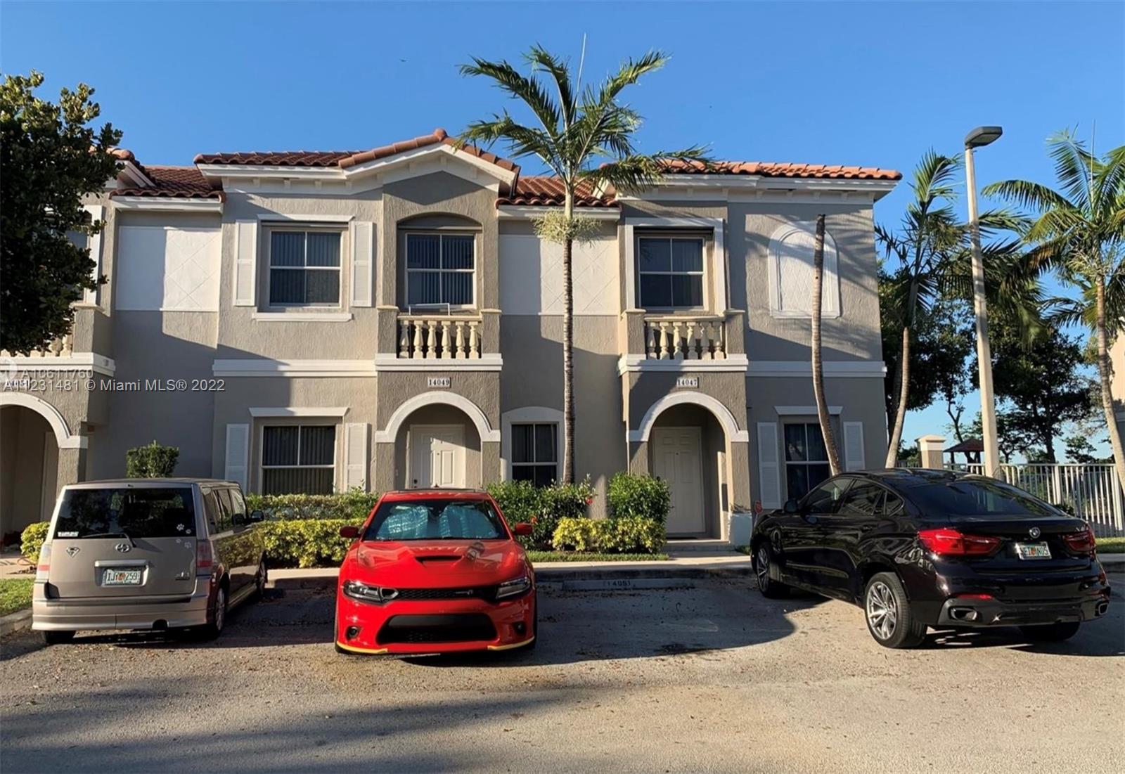 a view of a car parked in front of a house