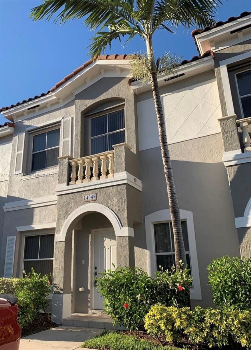 Vizcaya Miramar, FL 33027 - Photo 2 of 15 a front view of a house with a garden