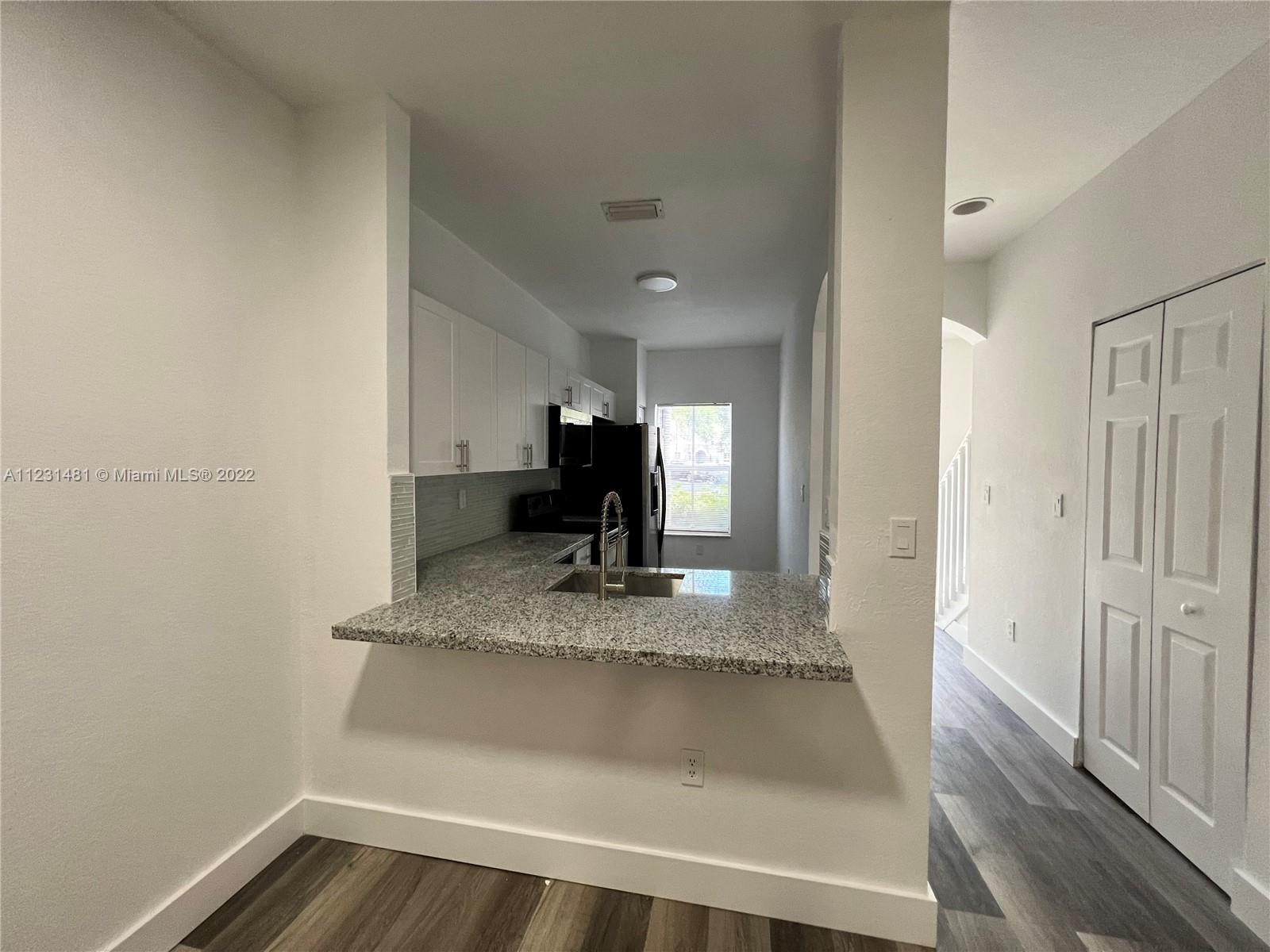 Vizcaya Miramar, FL 33027 - Photo 6 of 15 a view of a hallway to a room and wooden floor