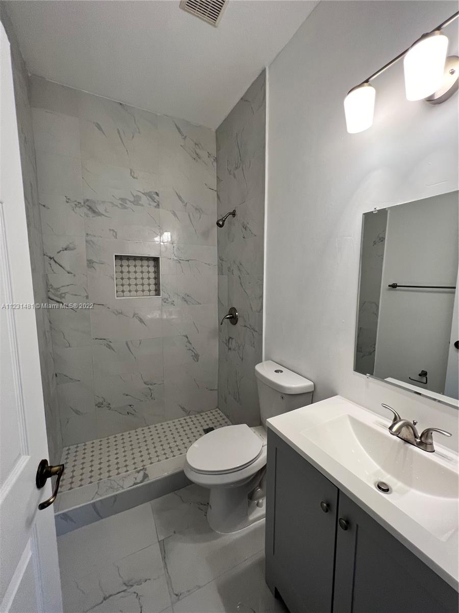 Vizcaya Miramar, FL 33027 - Photo 7 of 15 a bathroom with a sink a toilet and shower