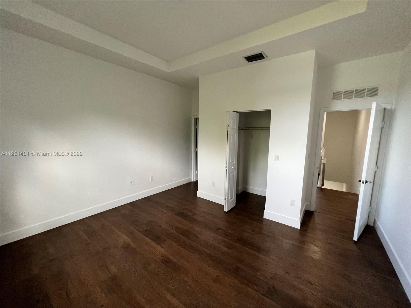 Vizcaya Miramar, FL 33027 - Photo 8 of 15 an empty room with wooden floor and closet