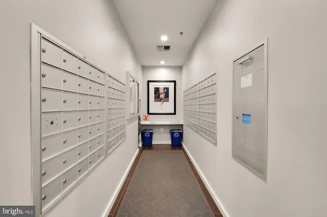 a view of a hallway with stairs