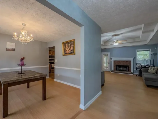 a bedroom with a bed and a ceiling fan