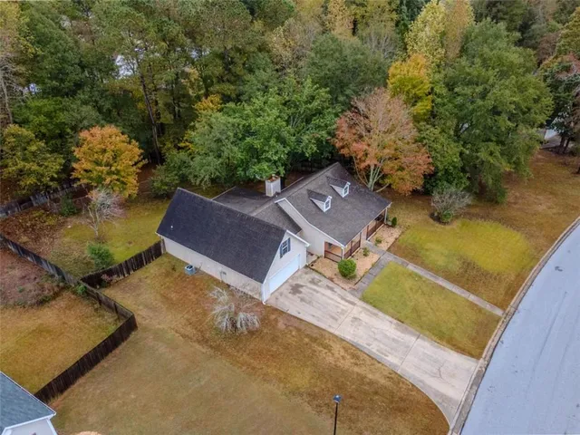 a aerial view of a house with swimming pool