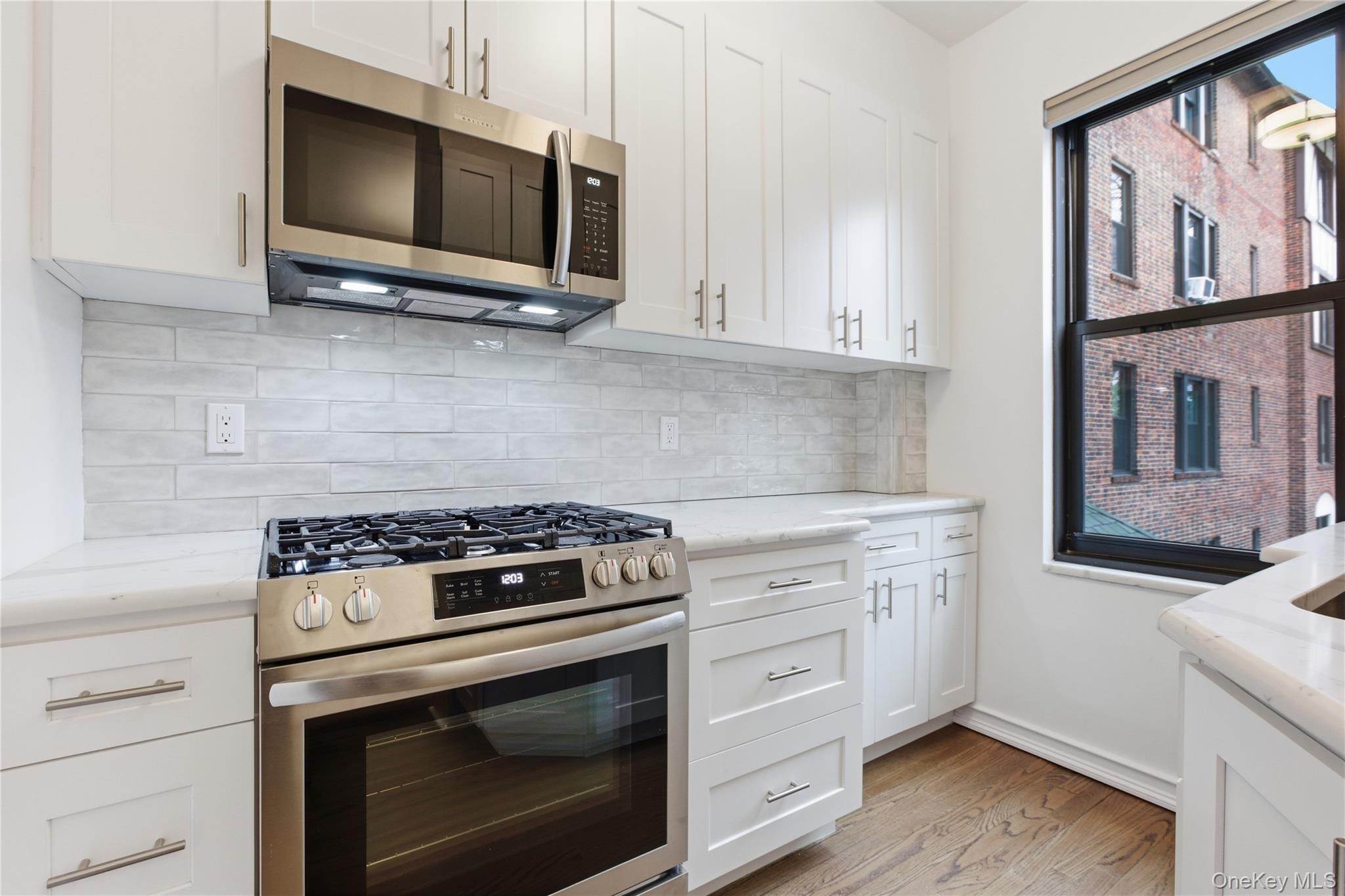 242 Bronxville Road, Unit E2 Bronxville, NY 10708 - Photo 9 of 19 Bright windowed kitchen