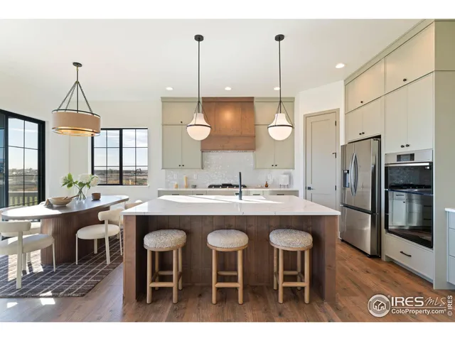 a kitchen with appliances and a table
