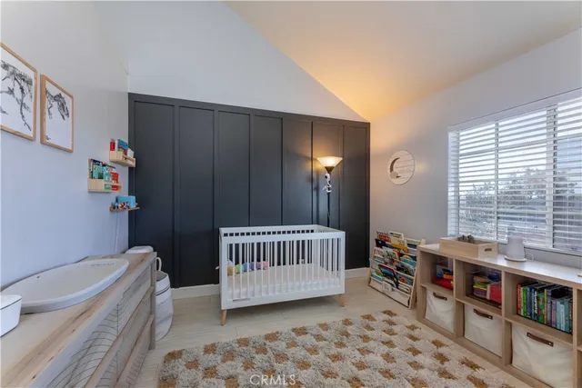 a room with furniture a rug and a window