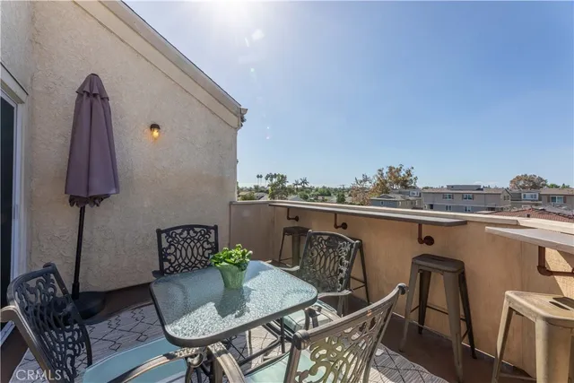 a view of a terrace with furniture and a potted plant