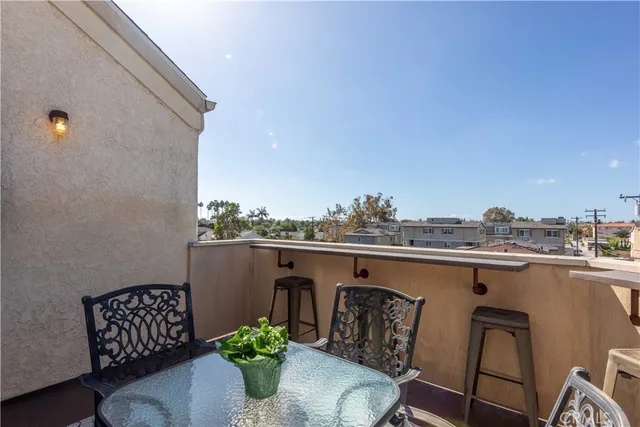 a terrace with a table and chairs