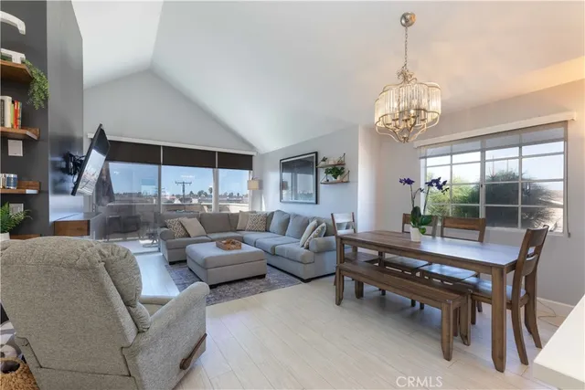 a living room with furniture chandelier and a chandelier