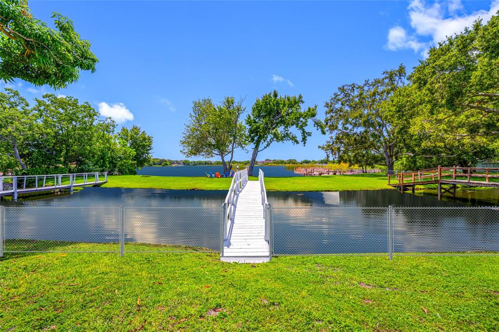 2153 Karan Way Clearwater, FL 33763 - Photo 6 of 65 a view of a lake with a yard