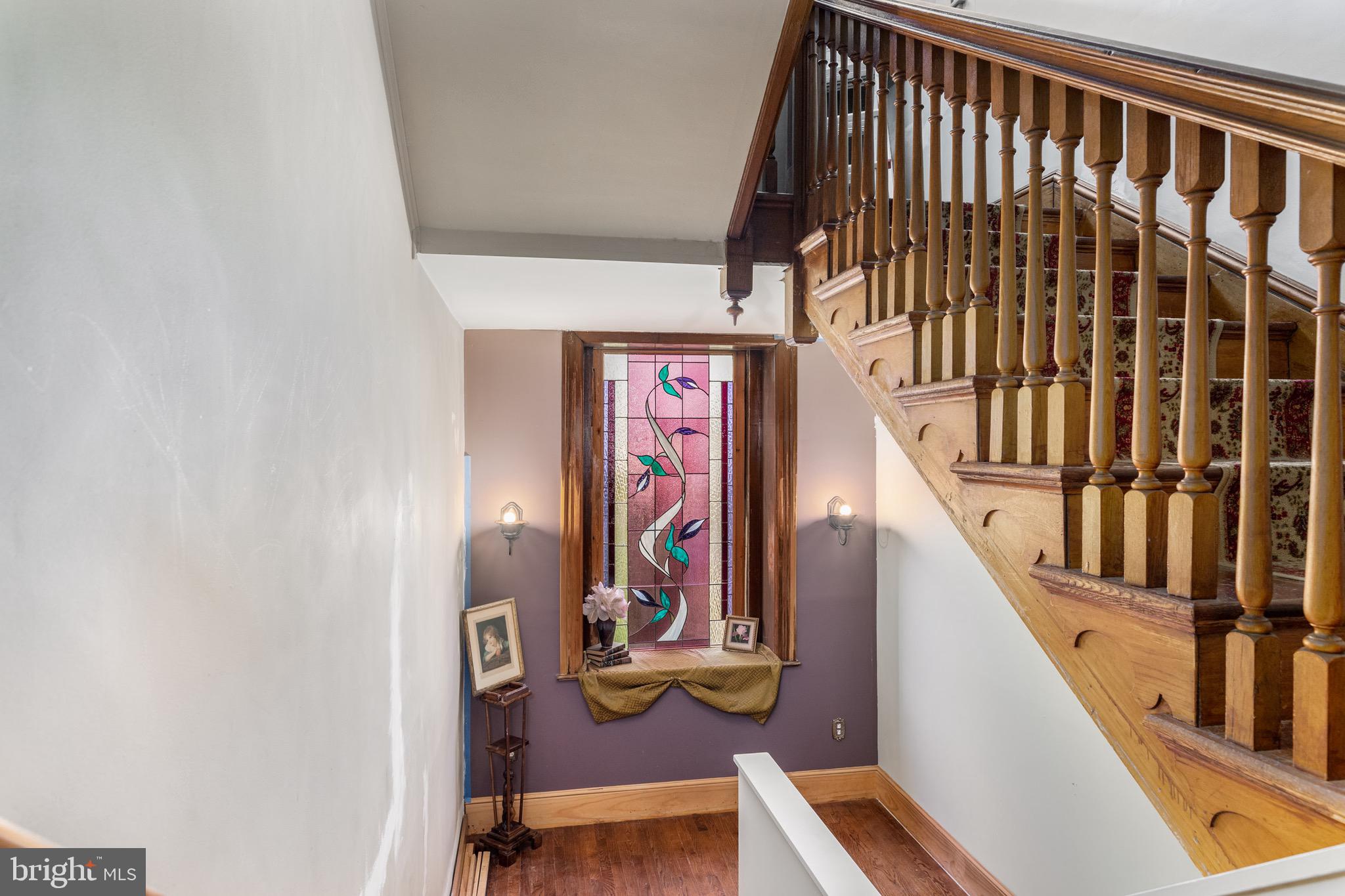 7330 Ridge Avenue Philadelphia, PA 19128 - Photo 12 of 31 Large stairs w/ landing and stained glass window